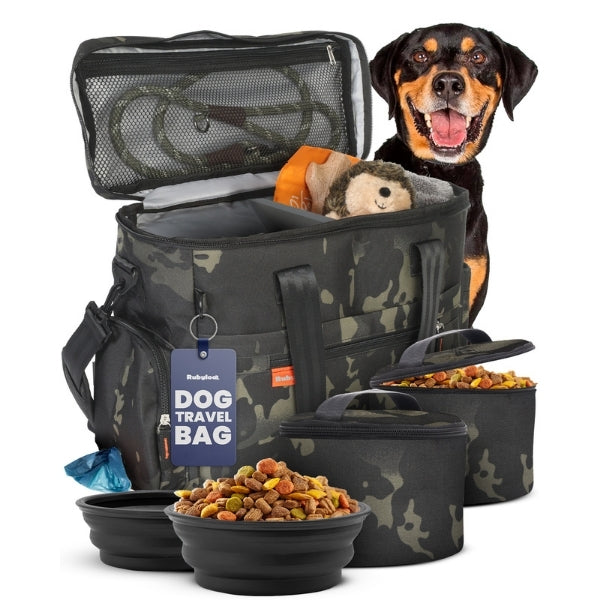 Original Doggy Bag in camo, dark green and black, with black bowls, matching food containers and a black and tan dog