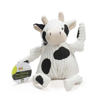 Dottie Cow Knottie dog toy, front view with cream horns, one black ear and a hang tag on its knotted arm