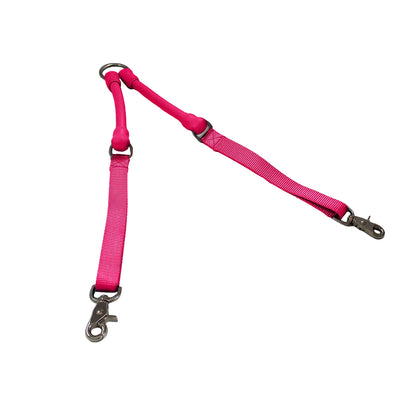 CRAZYcoupl'r Two-Dog Leash Coupler in hot pink laid out in a V, top view on a white background