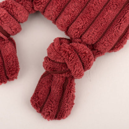 Close-up of a knotted leg on the red fox Flattie, showing the tied corduroy knot