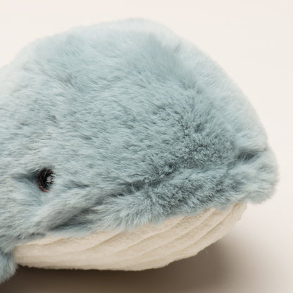 Mobie Whale Wee Huggles close-up of one whale's face, soft gray faux fur, small dark eye and white corduroy belly