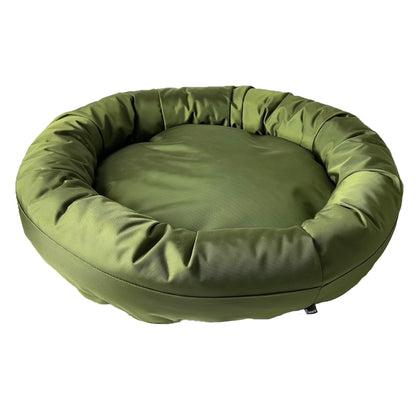 Round Bolstered Armor dog bed in olive green seen from above, a wide center cushion inside the rim
