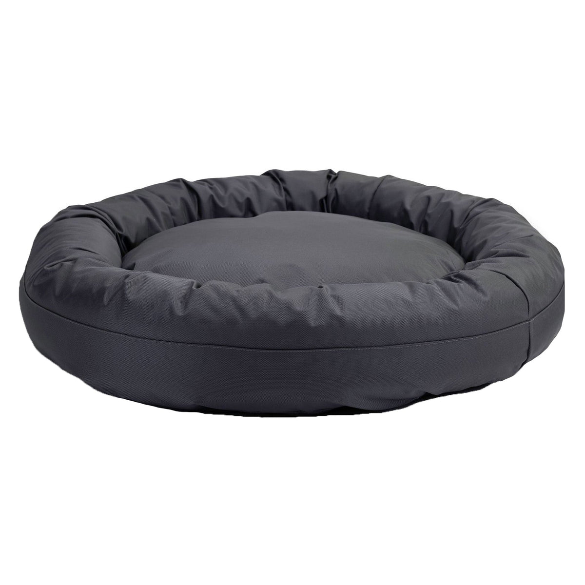 American Dog Round Bolstered Armor dog bed in charcoal gray, ballistic nylon with a raised rim, on a white background