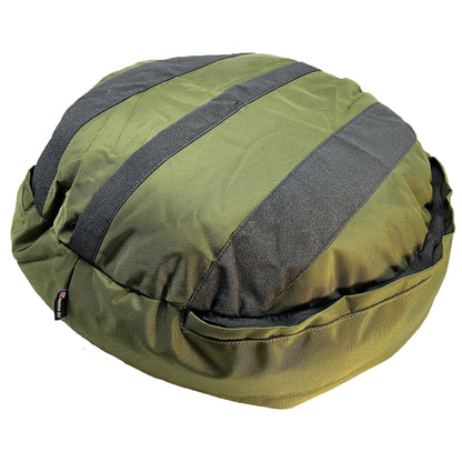 Round Bolstered Armor dog bed in olive, underside with three black non-skid strips and the cover zipper