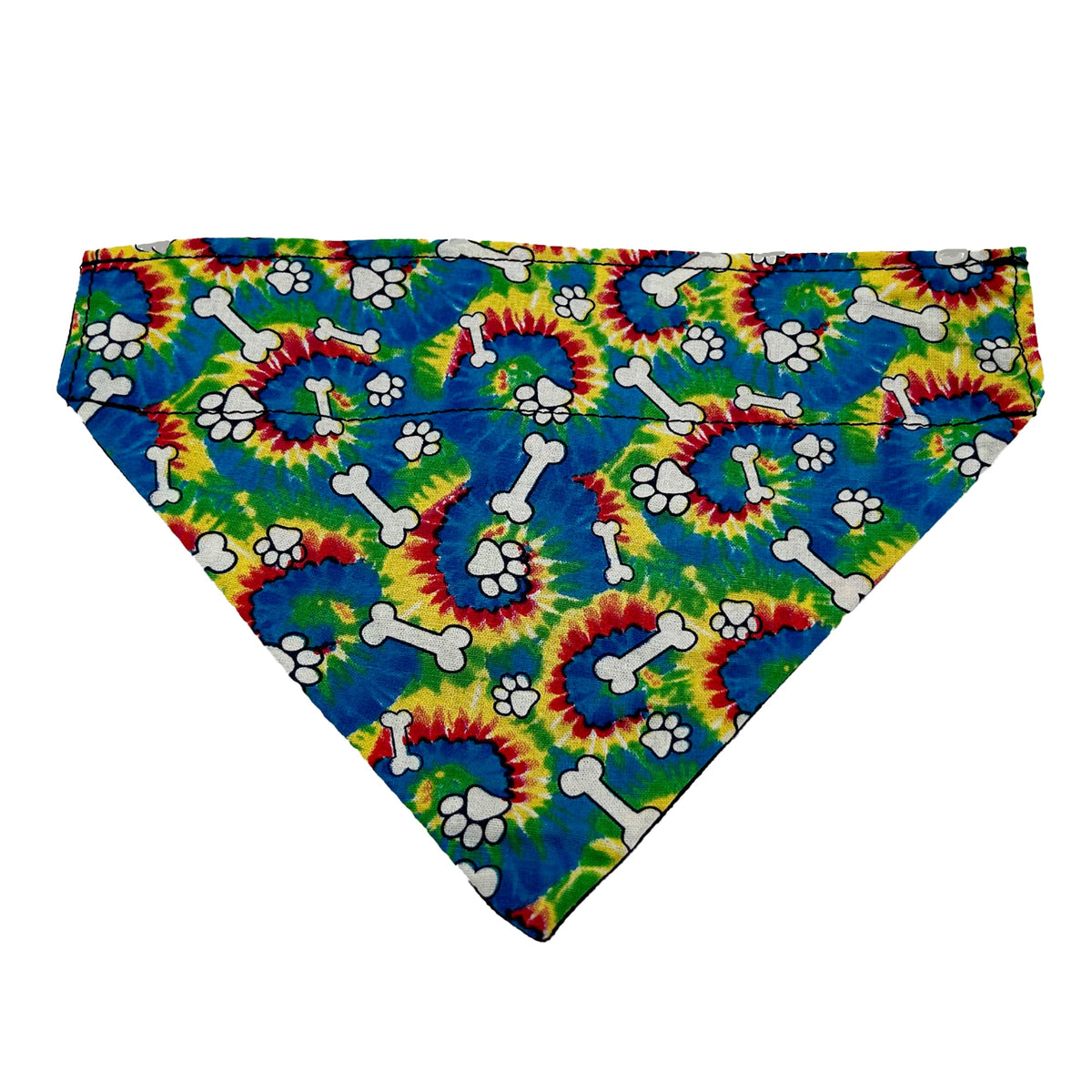 Slip-on dog bandana in bone and paw tie-dye, white bones and paw prints on blue, green, yellow and red swirls