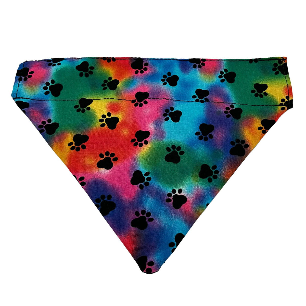 Slip-on dog bandana in paw tie-dye, black paw prints over soft rainbow tie-dye in pink, blue and green