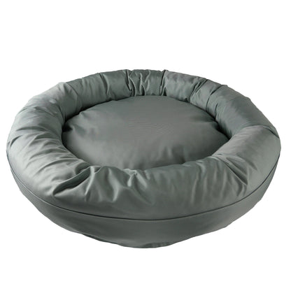 Round Bolstered Armor dog bed in silver gray, angled view of the rim and center cushion