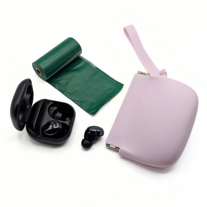 Up Dog One-Hand Treat Pouch in purple laid beside a poop bag roll and wireless earbuds, things it can carry