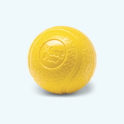 Boundr squishy ball, Large in dandelion yellow, showing the textured skin and seam line