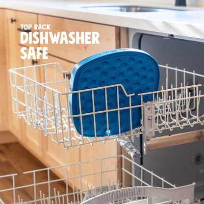 Marine blue Feast Mat in a dishwasher top rack, lick-mat side facing out