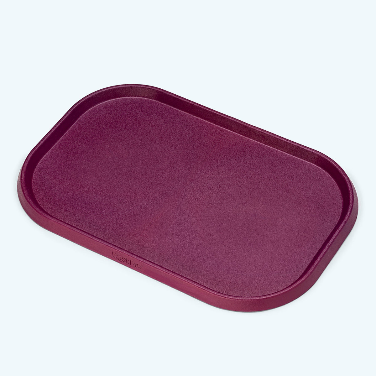 Non-Slip Placemat in tropic red, a deep berry shade, angled view of the rim