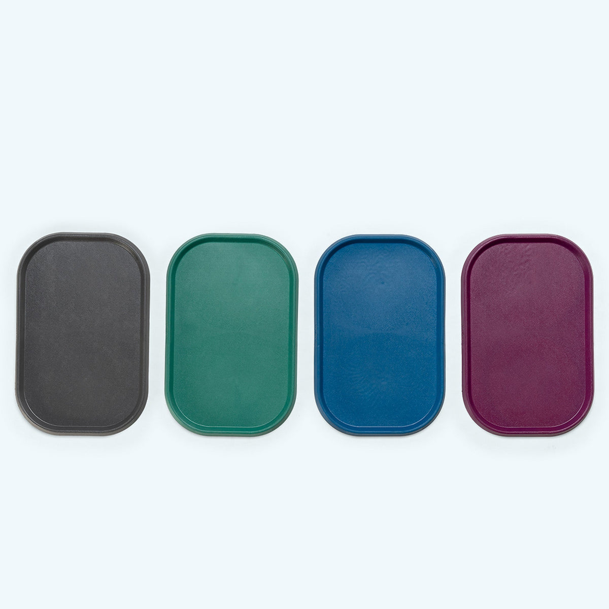 Non-Slip Placemat in all four colors from above: sea fog gray, kelp green, marine blue and tropic red