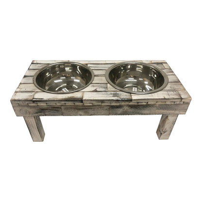 Huntley Pet Berjen raised dog feeder in white wash reclaimed wood with two stainless steel bowls, three-quarter view