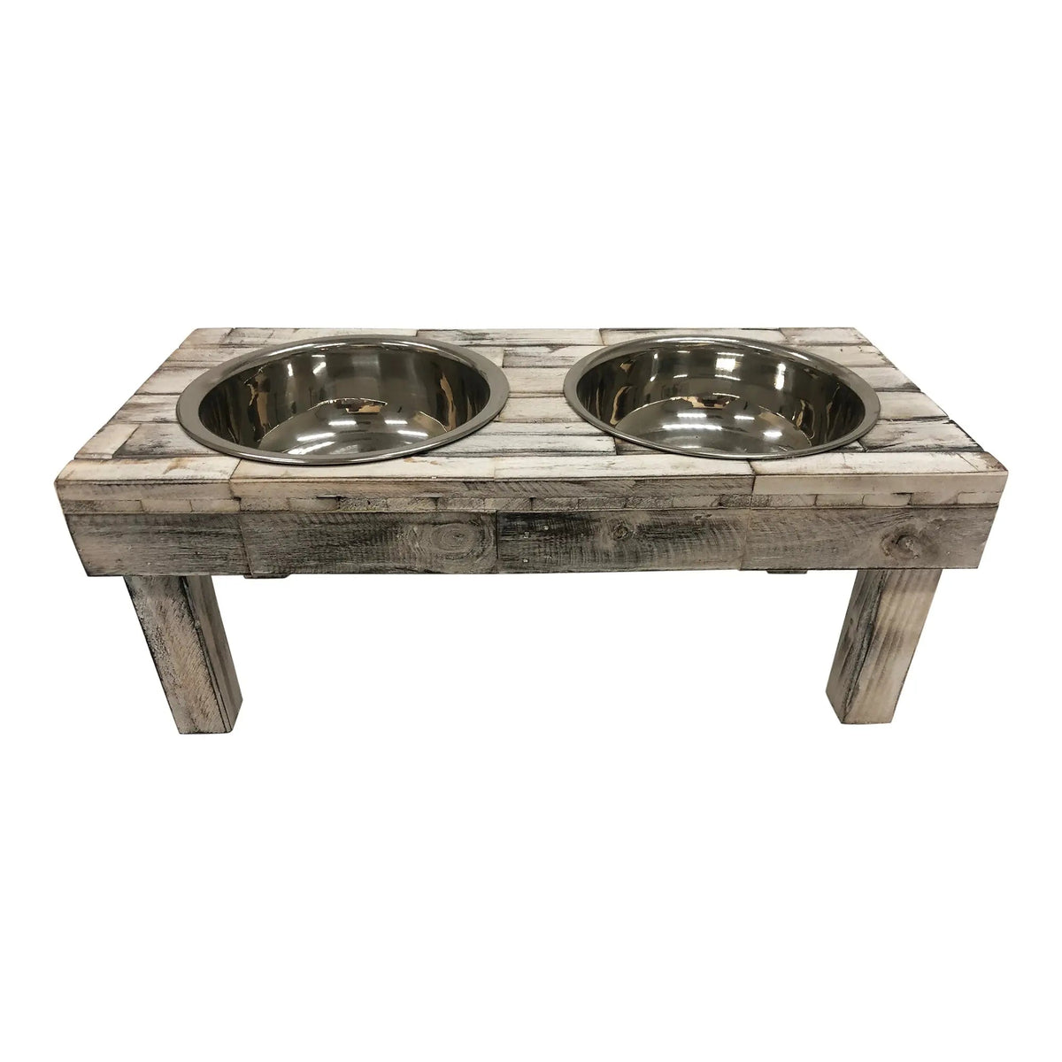 Front view of the white wash raised dog feeder from slightly above, two stainless bowls side by side