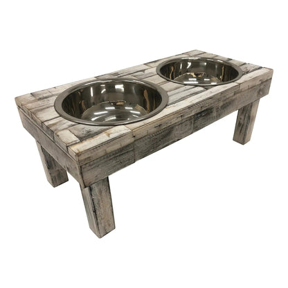 Raised dog feeder in distressed white wash wood from the right corner, showing the plank tabletop