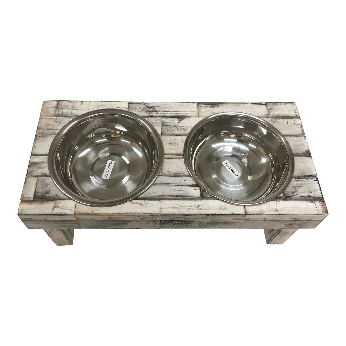 Top-down view of the white wash raised dog feeder with both stainless steel bowls in place