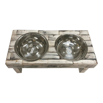Top-down view of the white wash raised dog feeder with both stainless steel bowls in place