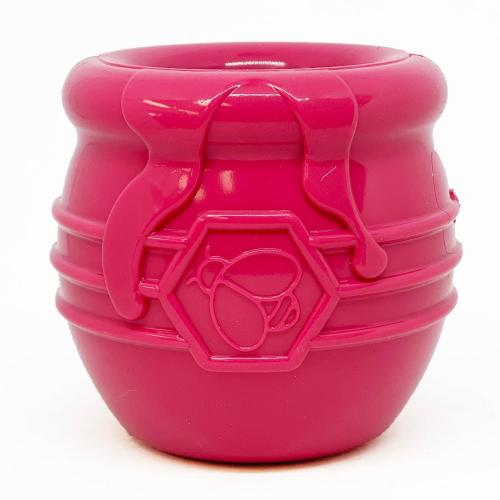 SodaPup Honey Pot Treat Cup in pink, front view of the ribbed rubber cup and bee emblem