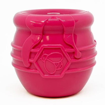 SodaPup Honey Pot Treat Cup in pink, front view of the ribbed rubber cup and bee emblem