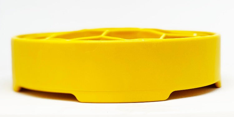 Yellow SodaPup Honeycomb eBowl in straight side profile, showing the notched feet along the base