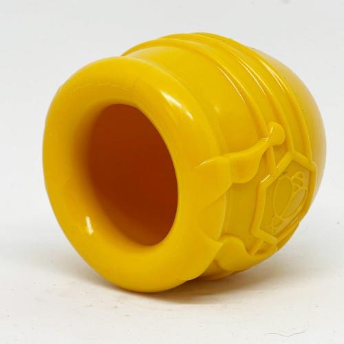 SodaPup Honey Pot Treat Cup in yellow lying on its side, angled view into the open end