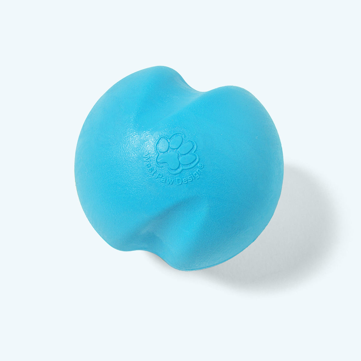 Aqua blue Jive ball, angled view with the embossed paw print, on a pale blue background