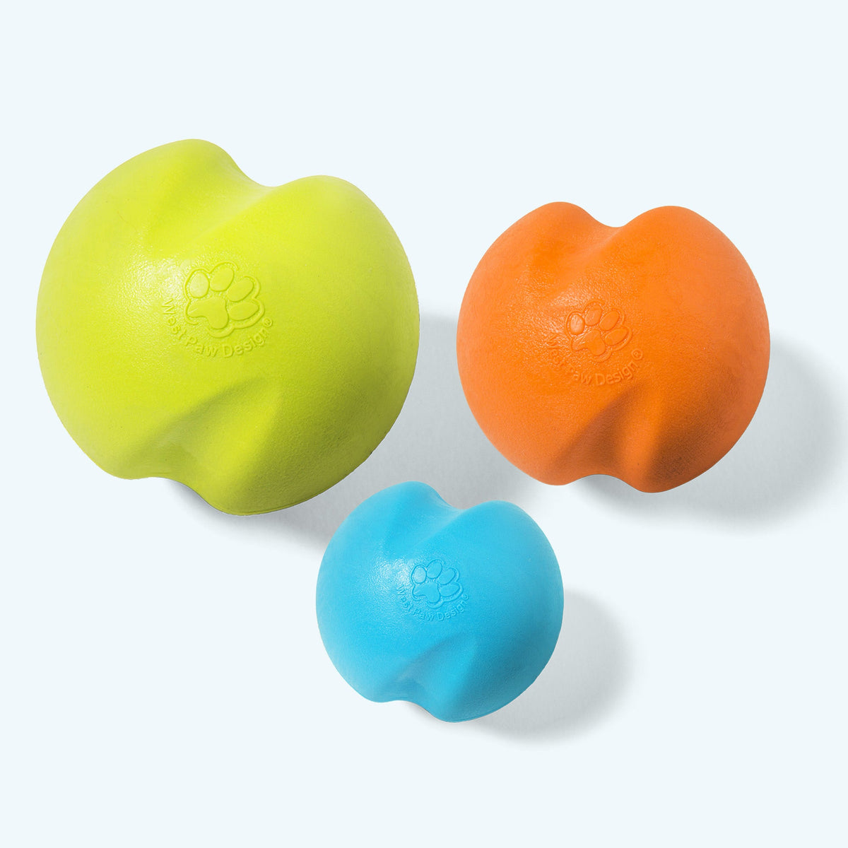 Three Jive dog balls by size: Large granny smith green, Small tangerine, XS aqua blue