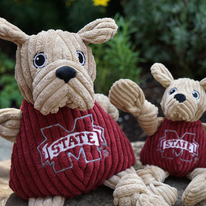Bully Knottie dog toy in two sizes outdoors, close-up of the jowly face, black nose and M-State shirt