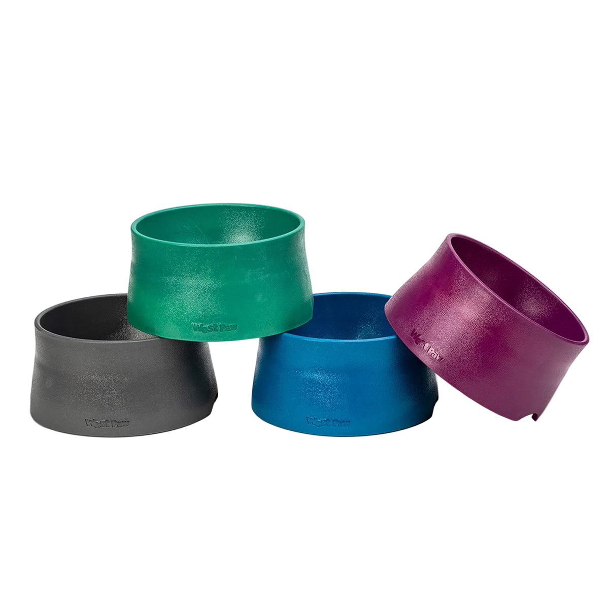 Four West Paw Non-Slip Bowls stacked in sea fog gray, kelp green, marine blue, and tropic red