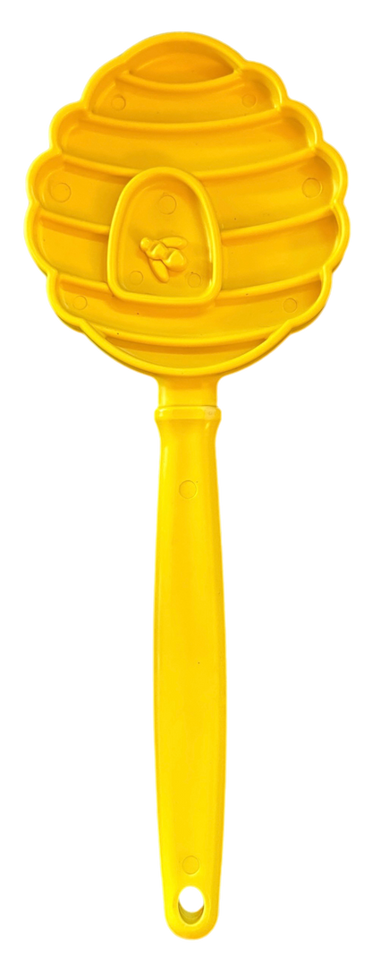 SodaPup eStick hand-held lick stick in the yellow beehive design, front view of the textured head and handle, on white