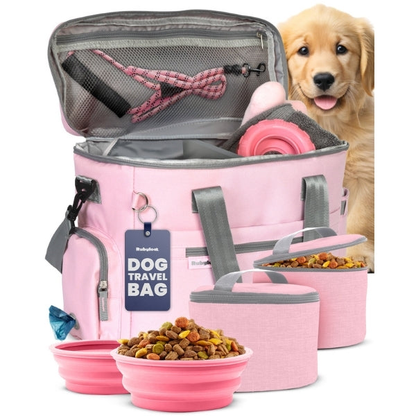 Original Doggy Bag in pink, lid open on the mesh pocket, with pink bowls, pink food containers and a golden puppy