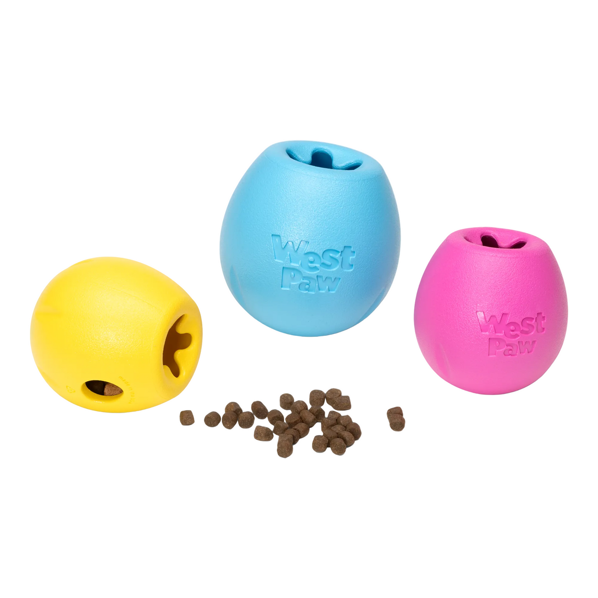 Rumbl treat dispensers in dandelion yellow, aqua and hot pink with dry kibble scattered in front