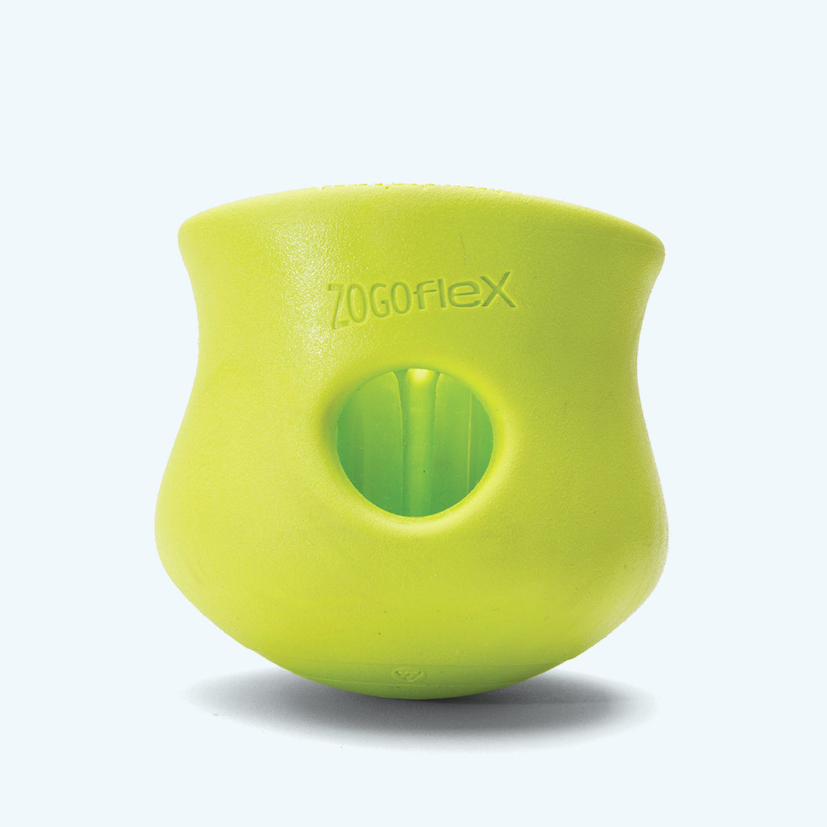 Green West Paw Toppl from the side, showing the Zogoflex label and the round side hole