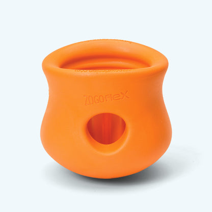 Tangerine West Paw Toppl from the side, showing the Zogoflex label and the round hole for nesting toys