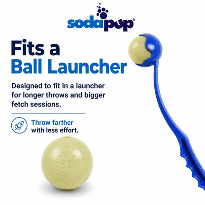 SodaPup Glitter Ball in glow in the dark, pale cream in daylight, shown loose and seated in a ball launcher