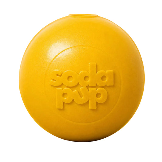 Yellow SodaPup Squeak Ball, front view on a yellow background showing the embossed logo