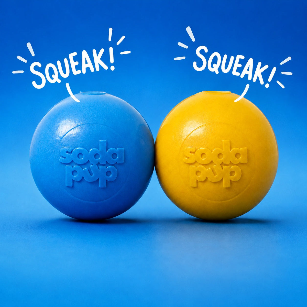 SodaPup Squeak Balls in light blue and yellow side by side on a blue background with the word Squeak above each