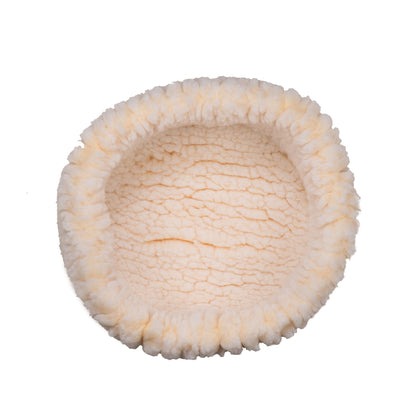 HuggleHounds HuggleSnuggler fleece bed for small dogs and cats, top view of the round natural cream bed and rim