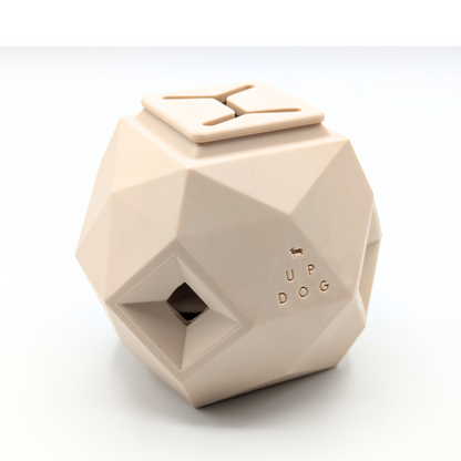 Up Dog Odin Treat Puzzle Ball in natural sand, angled view on a white background