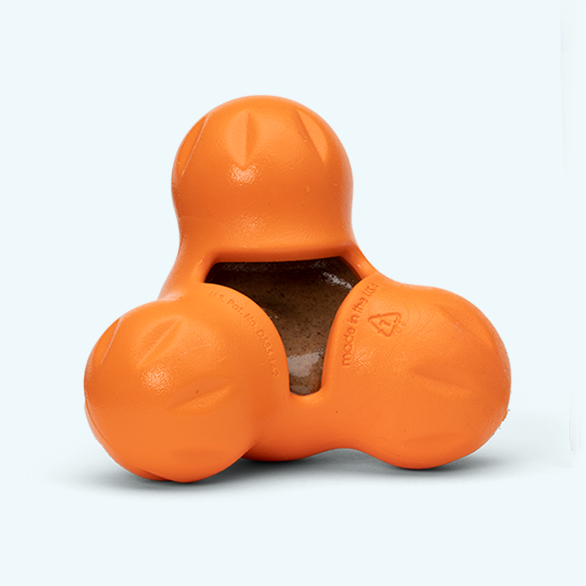 Tux treat toy in tangerine with a brown spread packed into the center pocket