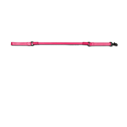 Urban Walk'r Short Stretch Leash in pink laid flat, handle at left and snap clip at right