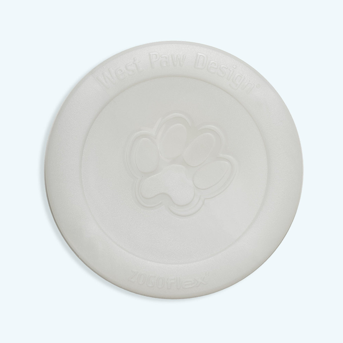 West Paw Zisc flying disc in the glow in the dark color, off-white in daylight, top view