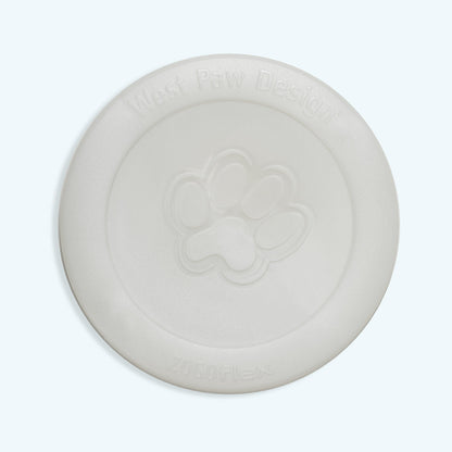 West Paw Zisc flying disc in the glow in the dark color, off-white in daylight, top view