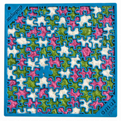 Jigsaw eMat lick mat in blue filled with pink, green and white spreads, a different color in each puzzle piece