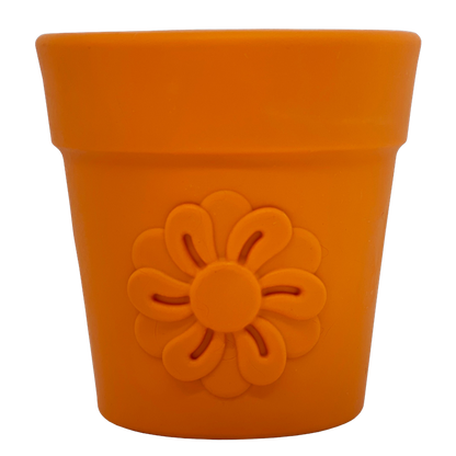 Flower Pot treat cup in terra cotta orange, front view of the molded flower on white