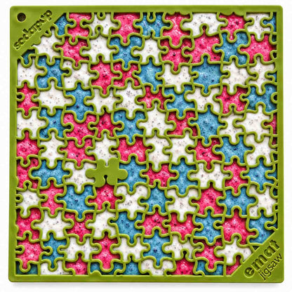 Jigsaw eMat lick mat in green filled with pink, blue and white spreads in alternating puzzle pieces