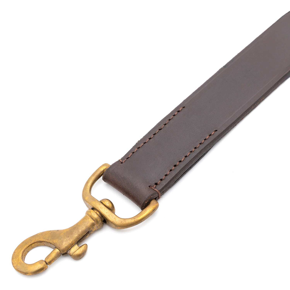 Stitched end of the Jeffers flat leather leash with its brass snap clip, close-up on white