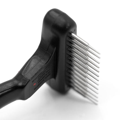 Side close-up of the Jeffers Magic Spring rake head showing its row of long rounded steel pins