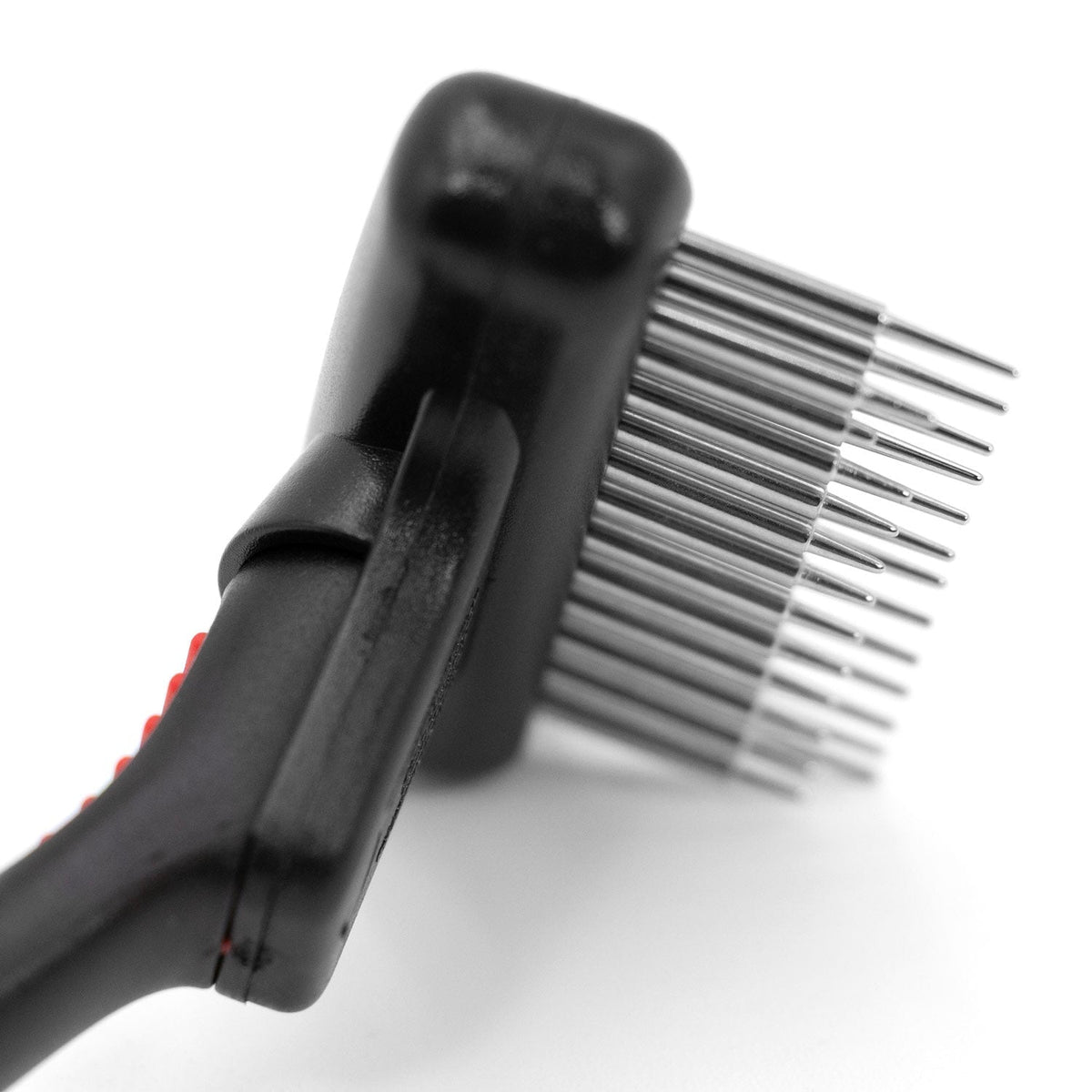 Side close-up of the double-row Jeffers Magic Spring rake, showing long and short steel pins