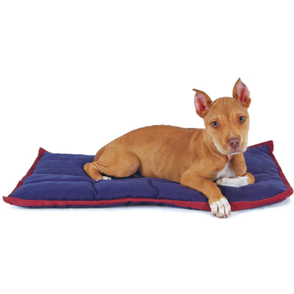 Tan puppy lying on a navy Jeffers washable crate pad with wine red trim